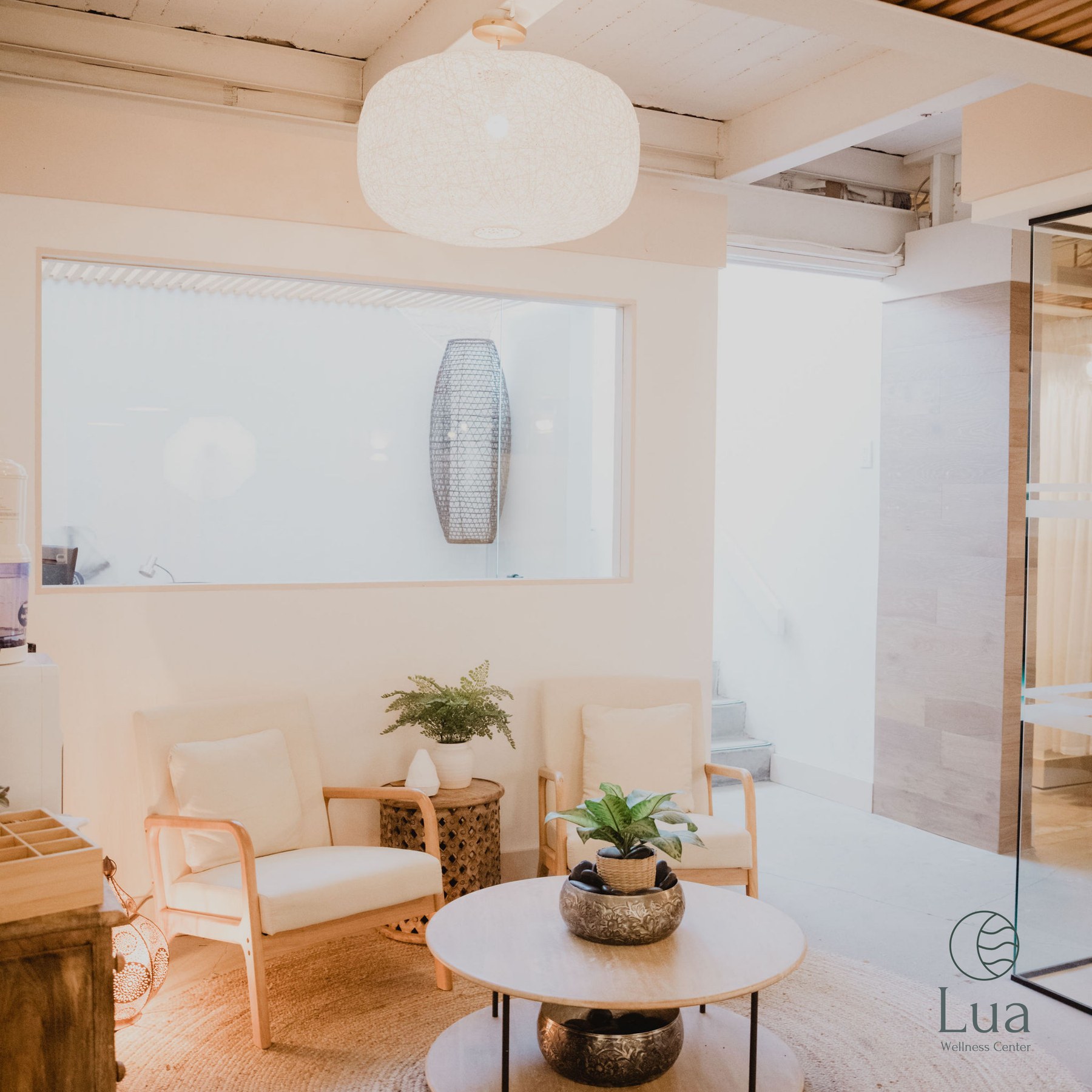 Chairs and a coffee table in the Lua reception lounge